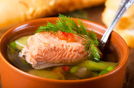 Fish a trout soup and bread with fennelの写真素材