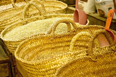 Cereal grain in yellow baskets in the markets of Moroccoの写真素材