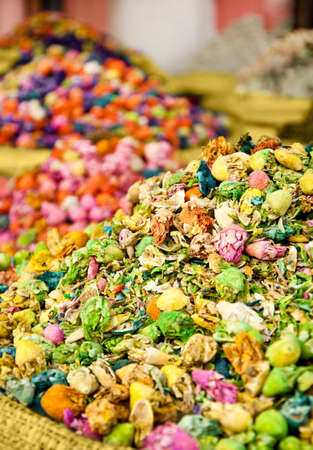 Multi-colored heap of spices from plants and flowersの写真素材