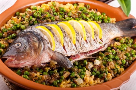 Baked crucian on a pillow from lentil and peasの写真素材