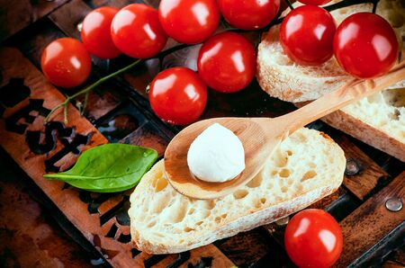 Mozzarella, tomatoes and bread. Italian foodの写真素材
