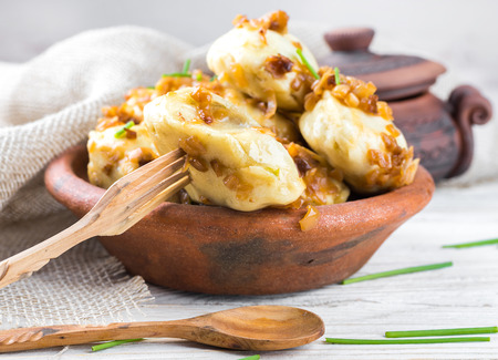 Ukrainian dumplings with cabbage, cheese and cherriesの写真素材