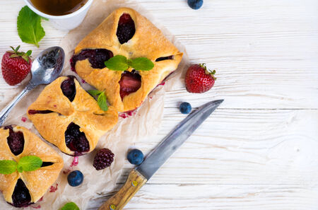 Fruit tarts with berries and fresh mintの写真素材