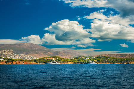 Greek island with colorful houses and yachts.の写真素材
