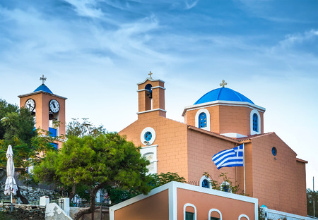 Greek island with colorful houses and yachts.の写真素材
