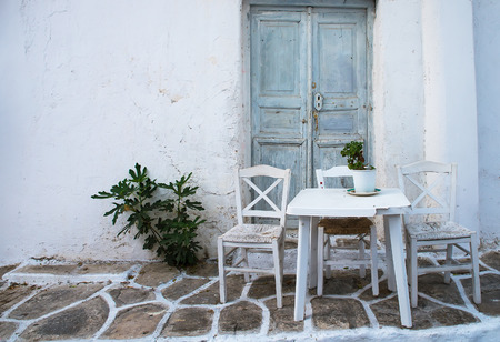 Greek island restaurants with colorful tables and chairs.の写真素材
