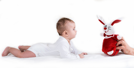 A small child playing successfully caught the rabbitの写真素材