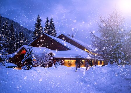 A fairy-tale house in the woods amid the snow-covered fir trees, Christmas landscape. Winter nature.
