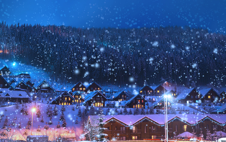 A fairy-tale house in the woods amid the snow-covered fir trees, Christmas landscape. Winter nature.の写真素材