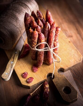 Thin uncooked smoked pork and beef sausages. Delicatessen meat.の写真素材