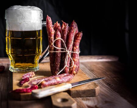 Thin uncooked smoked pork and beef sausages. Delicatessen meat.の写真素材