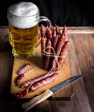 Thin uncooked smoked pork and beef sausages. Delicatessen meat.の写真素材
