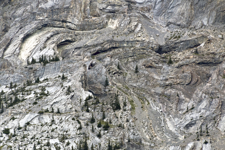 Interesting formations on the side of a mountain give a gnarled appearance.の写真素材
