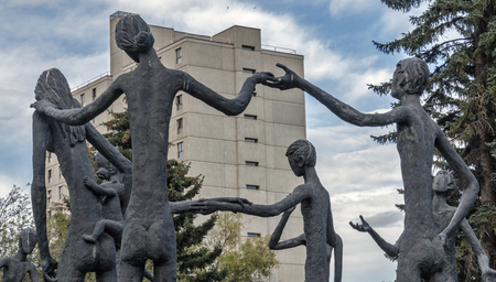 Calgary, Alberta/Canada â August 30, 2015: A rear view of "Family of Man", build by Mario Hubert Armengol, outside the Calgary Education Centre in Calgary, Alberta.のeditorial素材