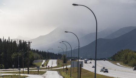 A view of the haze obscured mountains near Harvie Heights in Alberta, Canada.の写真素材