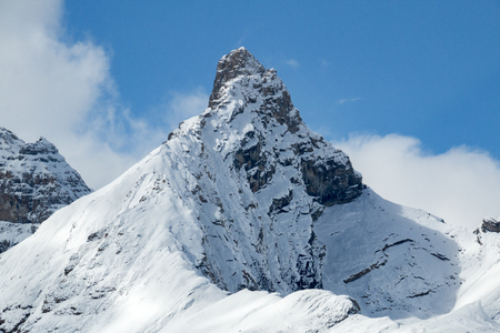 A solitary, snow-covered mountain peak in Jasper National Park, Alberta, Canada.の写真素材