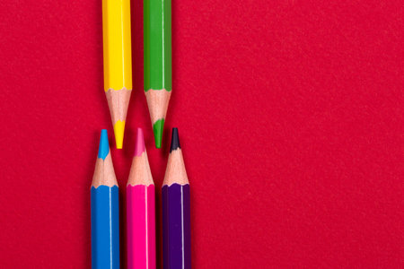 Color pencils on red paperの写真素材