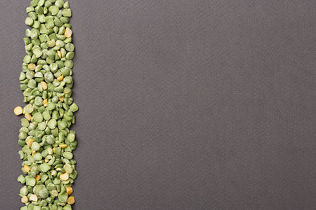 Peas line on left side of gray paper background
