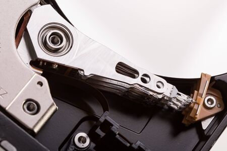 Open computer hard drive disc on white