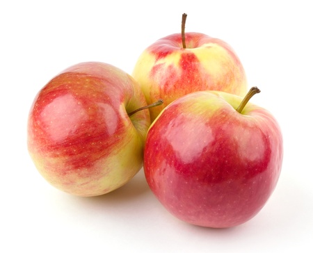 Three red apples isolated on white backgroundの写真素材
