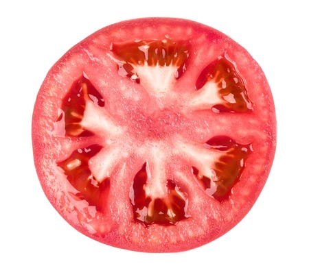 Tomato slice isolated on white backgroundの写真素材