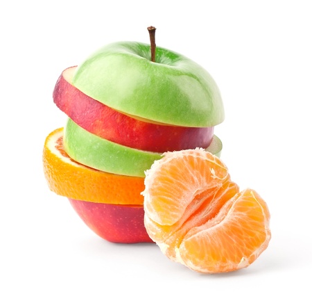 Layers of apples and oranges with slice of tangerine isolated on white backgroundの写真素材