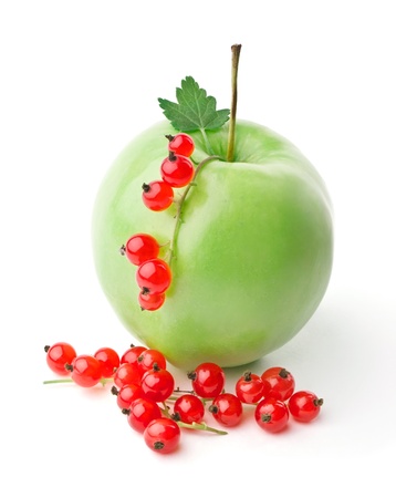 Apple and sprigs of red currants isolated on white backgroundの写真素材