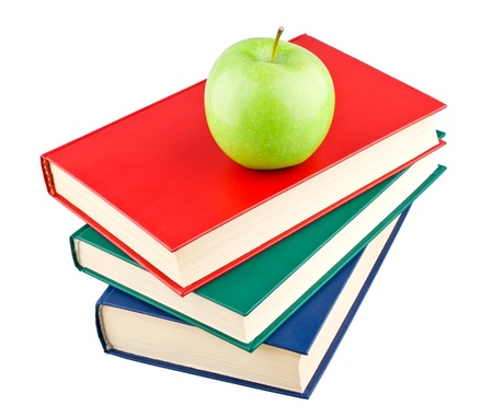 Three color books and green apple on white backgroundの写真素材