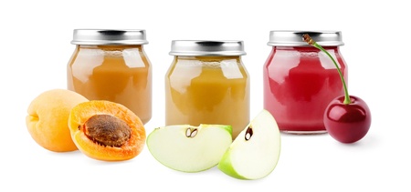 Apricot, apple and cherry baby puree on white backgroundの写真素材