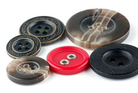 Various sewing buttons on white background 