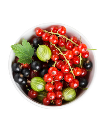 Fresh currants berries in bowl on white . Healthy foodの写真素材