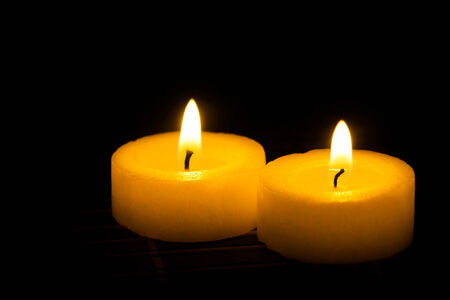Two candles in the darkの写真素材