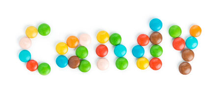 Candy word made of colorful candies on white の写真素材