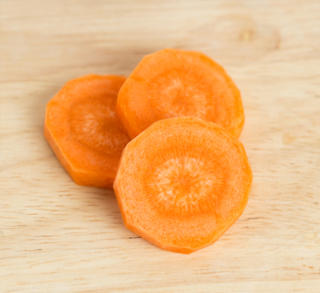 Carrot slices on tableの写真素材