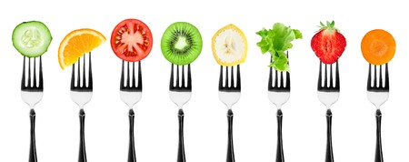 Fruits and vegetables on the forks. Healthy foodの写真素材