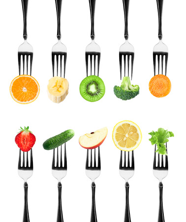 Fruits and vegetables on the forks. Healthy foodの写真素材