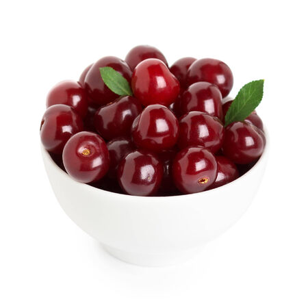 Sweet ripe cherry in bowl on white backgroundの写真素材