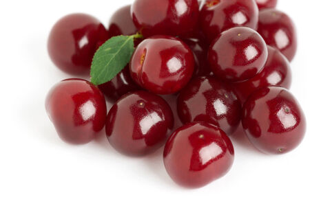 Ripe cherries with leaf on white backgroundの写真素材