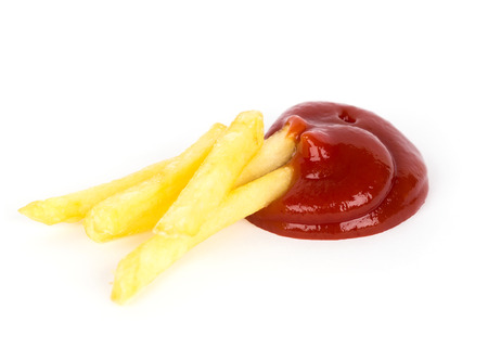 Pile of french fries with ketchup on white backgroundの写真素材