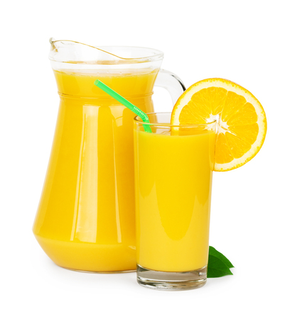Fresh orange juice in pitcher on white backgroundの写真素材