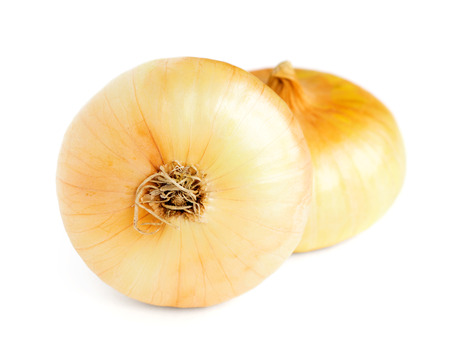 Ripe onions on a white background の写真素材