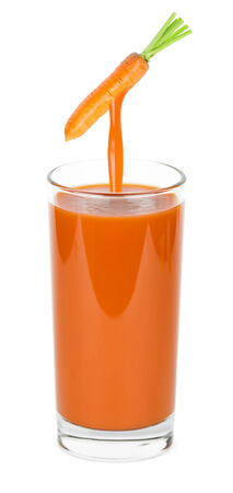 Glass of carrot juice on white backgroundの写真素材