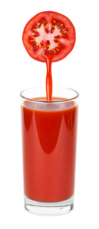 Glass of tomato juice on white backgroundの写真素材
