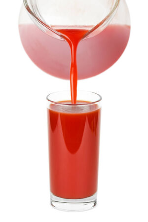 Glass of tomato juice on white backgroundの写真素材