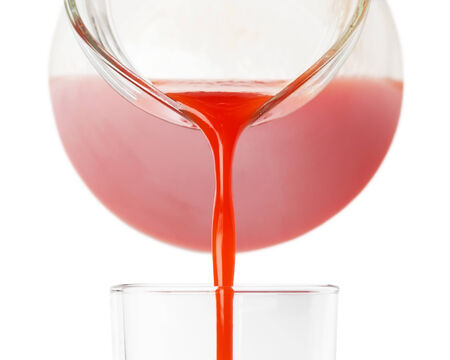 Fresh tomato juice on white backgroundの写真素材