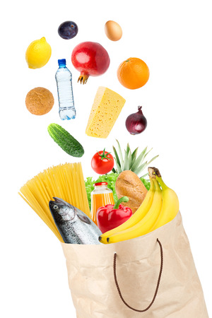 Grocery bag with healthy food on white backgroundの写真素材
