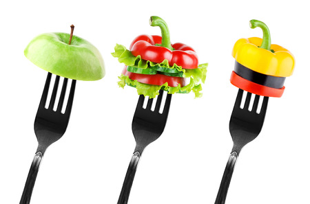 Fruit and vegetable slices on fork. Diet conceptの写真素材