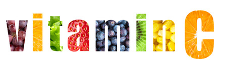 Vitamin C word on white background. Fresh fruits and vegetablesの写真素材
