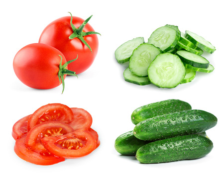 Fresh vegetables on white background. Tomato and cucumber slicesの写真素材