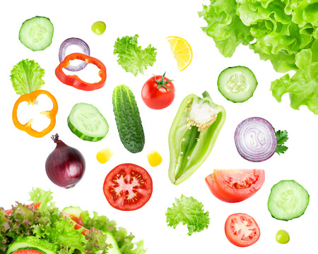 Mixed falling vegetables on white background. Fresh saladの写真素材
